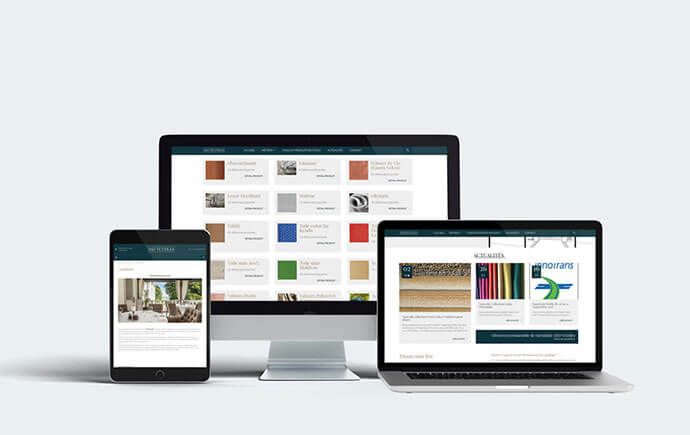 Maquette du site ASD Textiles sur ordinateur, portable et tablette : catalogue de produits et page Actualités